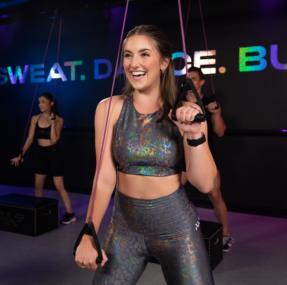 Person working out in dance class with weights